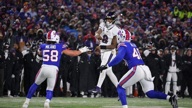 ORCHARD PARK, NEW YORK - JANUARY 19: Lamar Jackson #8 of the Baltimore Ravens throws a pass against Matt Milano #58 of the Buffalo Bills in the second quarter during the AFC Divisional Playoff at Highmark Stadium on January 19, 2025 in Orchard Park, New York.  (Photo by Timothy T Ludwig/Getty Images)