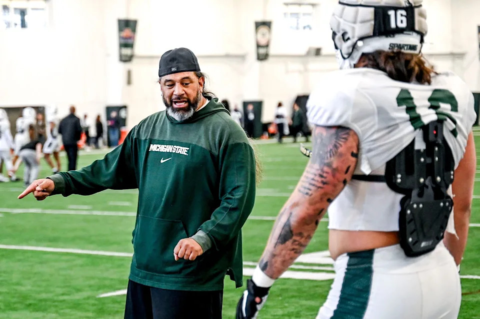 Michigan State defensive line coach Legi Suiaunoa, left, works with Grady Kelly during football practice on Tuesday, April 8, 2025, in East Lansing.