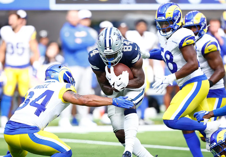 INGLEWOOD, CALIFORNIA - AUGUST 11: Kelvin Harmon #84 of the Dallas Cowboys makes a pass reception against Tanner Ingle #34 of the Los Angeles Rams in the second half during a preseason game at SoFi Stadium on August 11, 2024 in Inglewood, California. (Photo by Ronald Martinez/Getty Images)