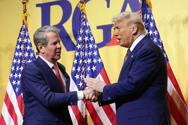 President Donald Trump, right, shakes hands with Gov. Brian Kemp, R-Ga., as he delivers remarks at the Republican Governors Association Meeting at The National Building Museum on Feb. 20, 2025, in Washington, D.C. (Win McNamee/Getty Images/TNS)