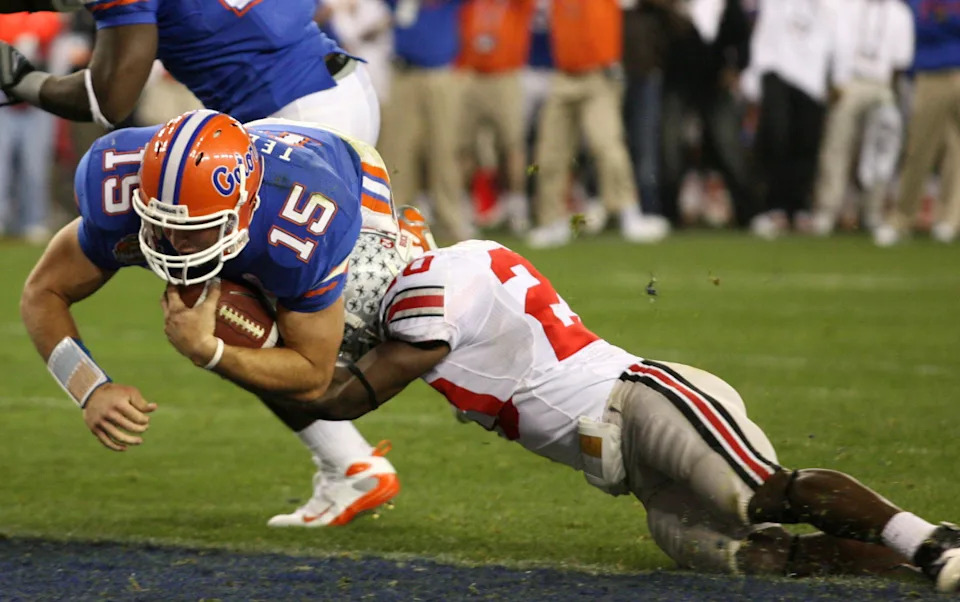 Florida Gators quarterback Tim Tebow scores a touchdown as Ohio State Buckeyes defensive back Donald Washington attempts a tackle in the BCS National Championship Game in Glendale, Arizona, on Jan. 8, 2007.Matthew Emmons-Imagn Images