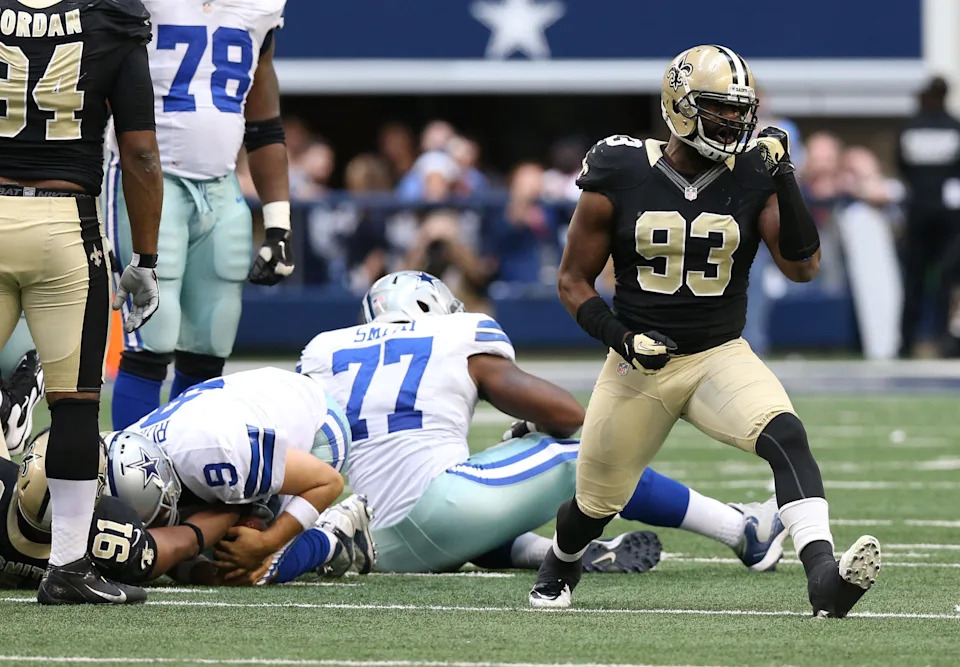 Dec 23, 2012; Arlington, TX, USA; New Orleans Saints defensive end Junior Galette (93) celebrates a sack against Dallas Cowboys quarterback Tony Romo (9) in the fourth quarter at Cowboys Stadium. The Saints beat the Cowboys 34-31 in overtime. Mandatory Credit: Matthew Emmons-USA TODAY Sports