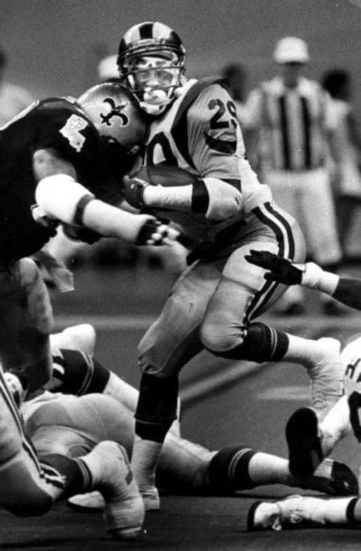 New Orleans Saints defensive lineman Jumpy Geathers tackles Los Angeles Rams running back Eric Dickerson. Credit: NOLA.com
