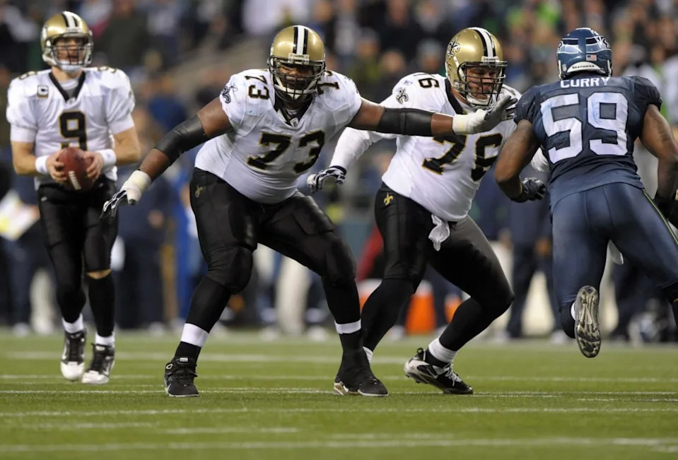 Jan 8, 2010; New Orleans Saints right guard Jahri Evans (73) looks to block against the Seattle Seahawks quarterback Drew Brees (9) drops back to pass in an NFC Wild Card playoff game. Mandatory Credit: Kirby Lee/Image of Sport-Imagn Images