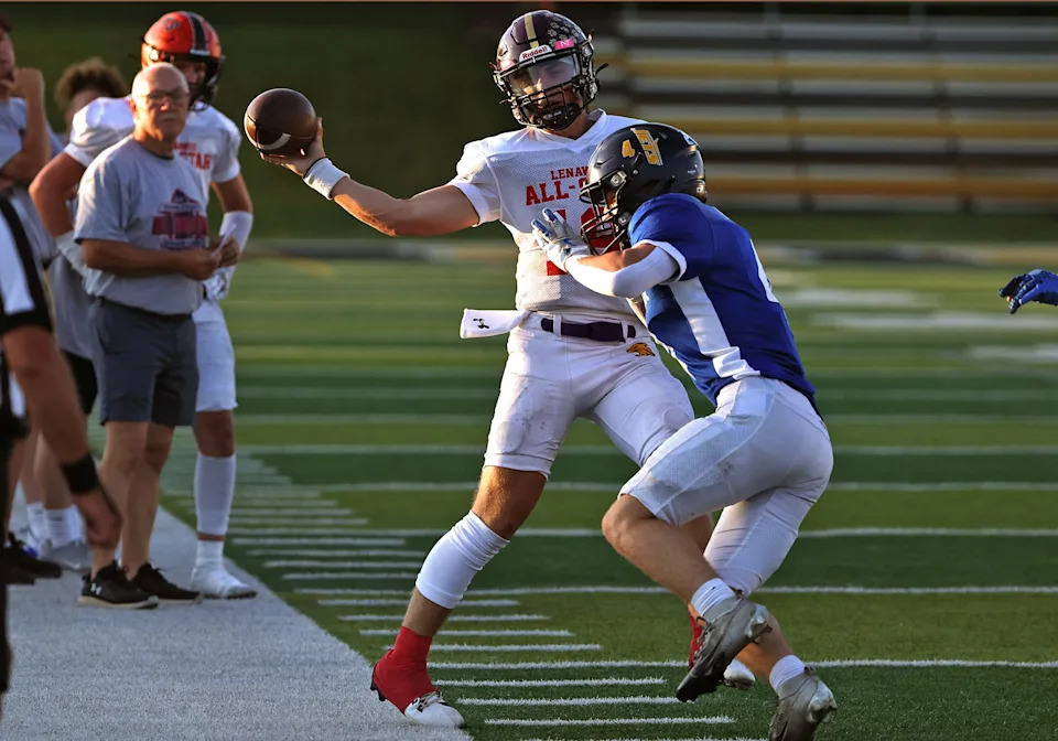 Onsted's Luke Manders is hit by Jordan Fields of Airport on the sidelines during the Monroe County vs. Lenawee County All-Star Football Game at Adrian College on Friday, June 20, 2025.
