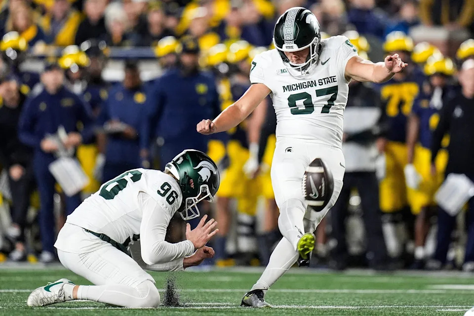 Michigan State place kicker Jonathan Kim (97) attempts a field goal against Michigan during the first half at Michigan Stadium in Ann Arbor on Saturday, Oct. 26, 2024.