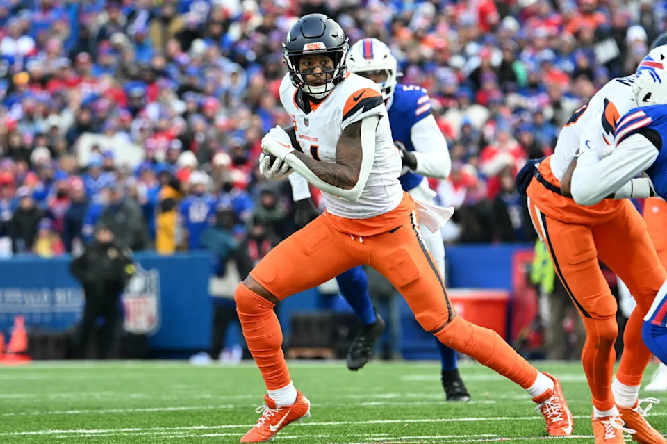 Denver Broncos wide receiver Courtland Sutton (14) runs after making a catch in the fourth quarter of an AFC wild card game against the Buffalo Bills at Highmark Stadium.Mark Konezny-Imagn Images