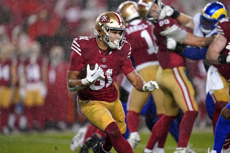 San Francisco 49ers running back Isaac Guerendo (31) runs the ball against the Los Angeles Rams in the second quarter at Levi's Stadium.Cary Edmondson-Imagn Images