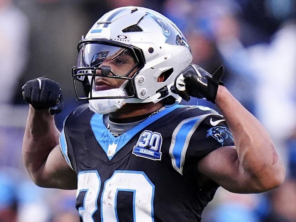  Carolina Panthers running back Chuba Hubbard celebrates after a long run against the Arizona Cardinals during overtime of an NFL football game, Sunday, Dec. 22, 2024, in Charlotte, N.C.