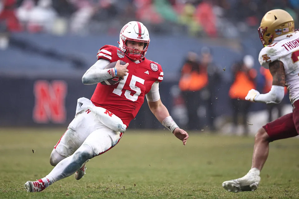 Dec 28, 2024; Bronx, NY, USA; Nebraska Cornhuskers quarterback Dylan Raiola (15) slides during the second half against the Boston College Eagles at Yankee Stadium. Mandatory Credit: Vincent Carchietta-Imagn Images