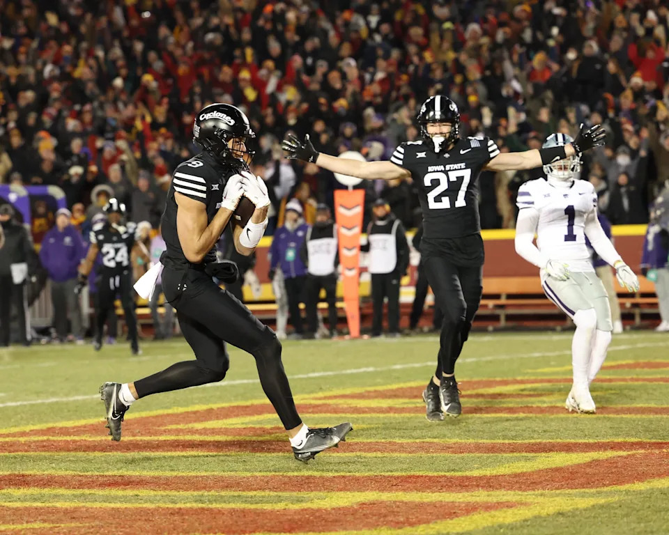 Nov 30, 2024; Ames, Iowa, USA; Iowa State Cyclones wide receiver Jayden Higgins (9) scores a touchdown against the Kansas State Wildcats in the first quarter at at Jack Trice Stadium. Mandatory Credit: Reese Strickland-Imagn Images