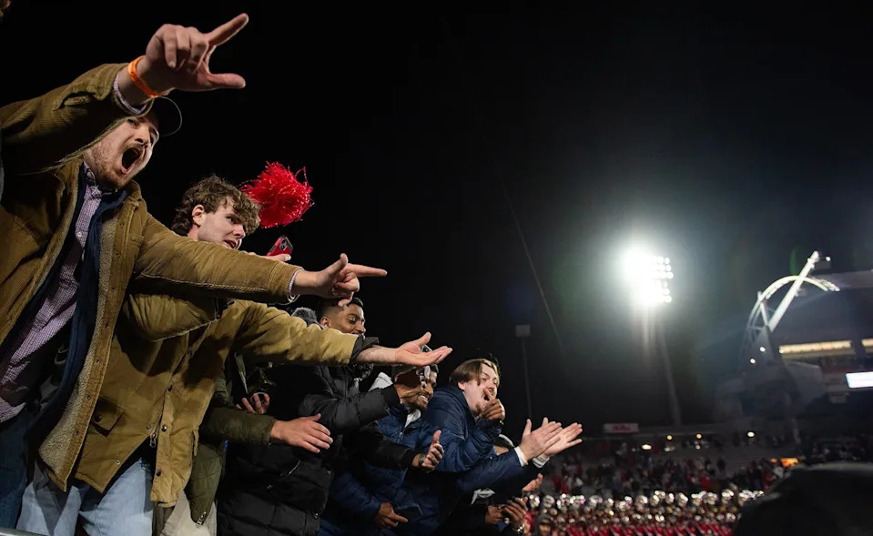 Mississippi fans cheer as players bring the Golden Egg trophy over to them after winning the Egg Bowl game against Mississippi State at Vaught-Hemingway Stadium on Friday, Nov. 29, 2024.