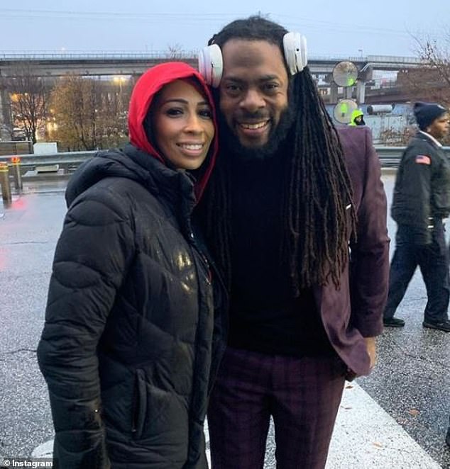 Sherman is seen alongside his wife, Ashley, whom he credits with protecting their kids