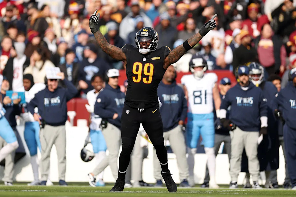 LANDOVER, MARYLAND - DECEMBER 01: Clelin Ferrell #99 of the Washington Commanders celebrates after a fumble recovery by the defense in the first quarter of a game against the Tennessee Titans at Northwest Stadium on December 01, 2024 in Landover, Maryland. (Photo by Scott Taetsch/Getty Images)