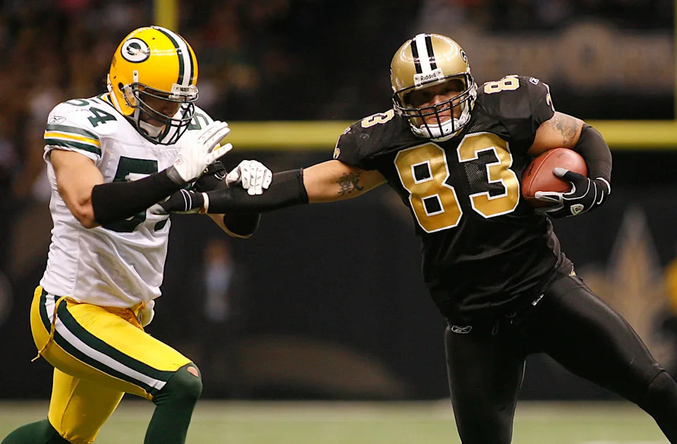 November 24, 2008; New Orleans Saints tight end Billy Miller (83) breaks a tackle against the Green Bay Packers. Mandatory Credit: Crystal LoGiudice-Imagn Images