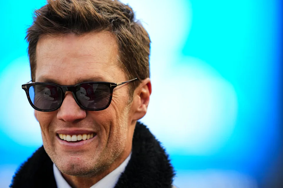 PHILADELPHIA, PA - JANUARY 12: Tom Brady looks on from the field during warmups prior to an NFL football wild card playoff game between the Green Bay Packers and the Philadelphia Eagles at Lincoln Financial Field on January 12, 2025 in Philadelphia, Pennsylvania. (Photo by Cooper Neill/Getty Images)Cooper Neill/Getty Images