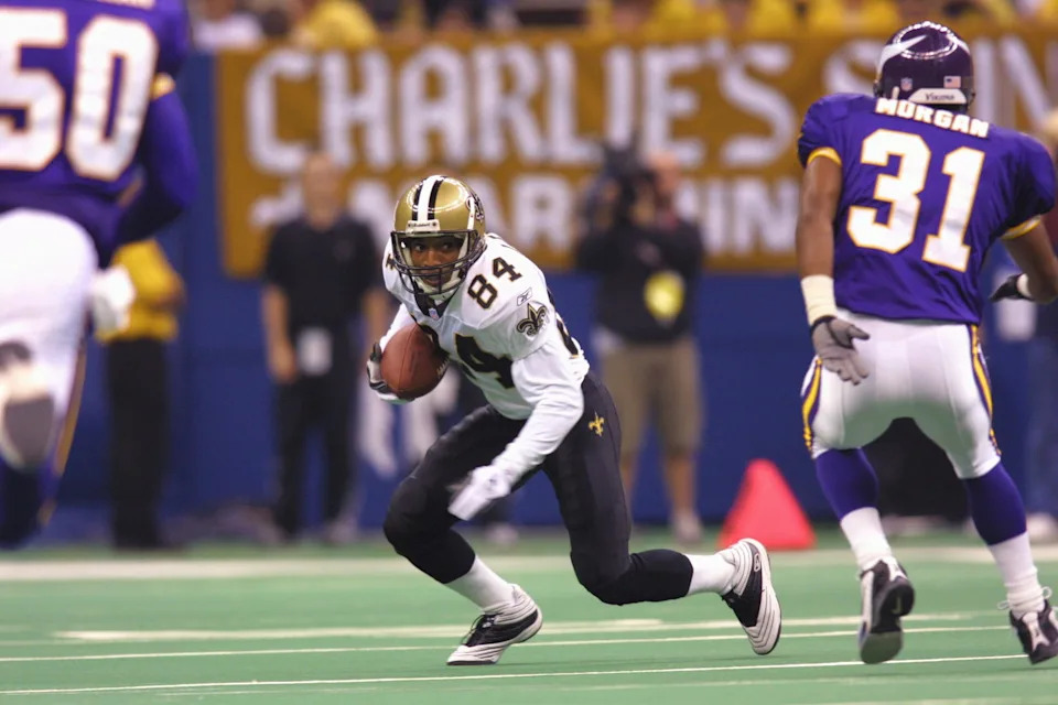7 Oct 2001: Michael Lewis #84 of the New Orleans Saints runs with the ball during the game against the Minnesota Vikings at the Superdome in New Orleans, Louisiana. The Saints won 28-15. DIGITAL IMAGE. Mandatory Credit: Ronald Martinez/ALLSPORT