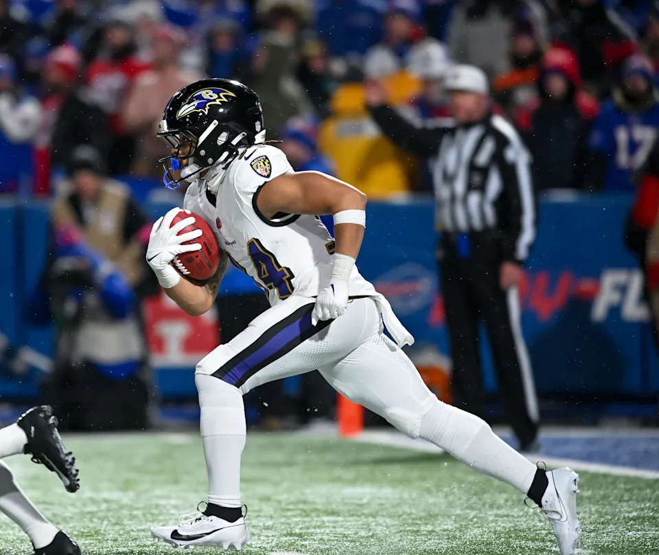 Jan 19, 2025; Orchard Park, New York, USA; Baltimore Ravens running back Keaton Mitchell (34) returns a kickoff against the Buffalo Bills in the fourth quarter of a 2025 AFC divisional round game against the Buffalo Bills at Highmark Stadium. Mandatory Credit: Mark Konezny-Imagn Images