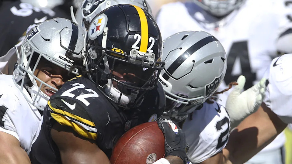 Damon Arnette tackling Najee Harris.Charles LeClaire-Imagn Images