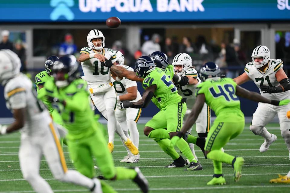 Dec 15, 2024; Seattle, Washington, USA; Green Bay Packers quarterback Jordan Love (10) passes the ball against the Seattle Seahawks during the second half at Lumen Field. Mandatory Credit: Steven Bisig-Imagn Images
