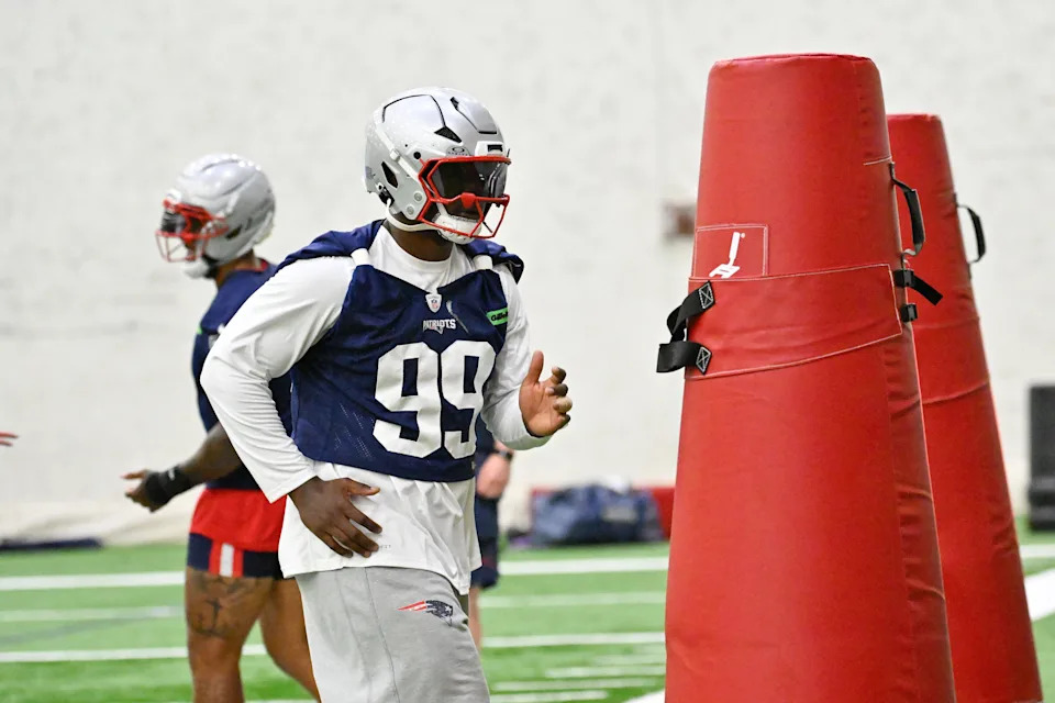 Jun 10, 2025; Foxborough, MA, USA; New England Patriots defensive end Keion White (99) works with a training aid during minicamp held in the WIN Field House at Gillette Stadium. Mandatory Credit: Eric Canha-Imagn Images
