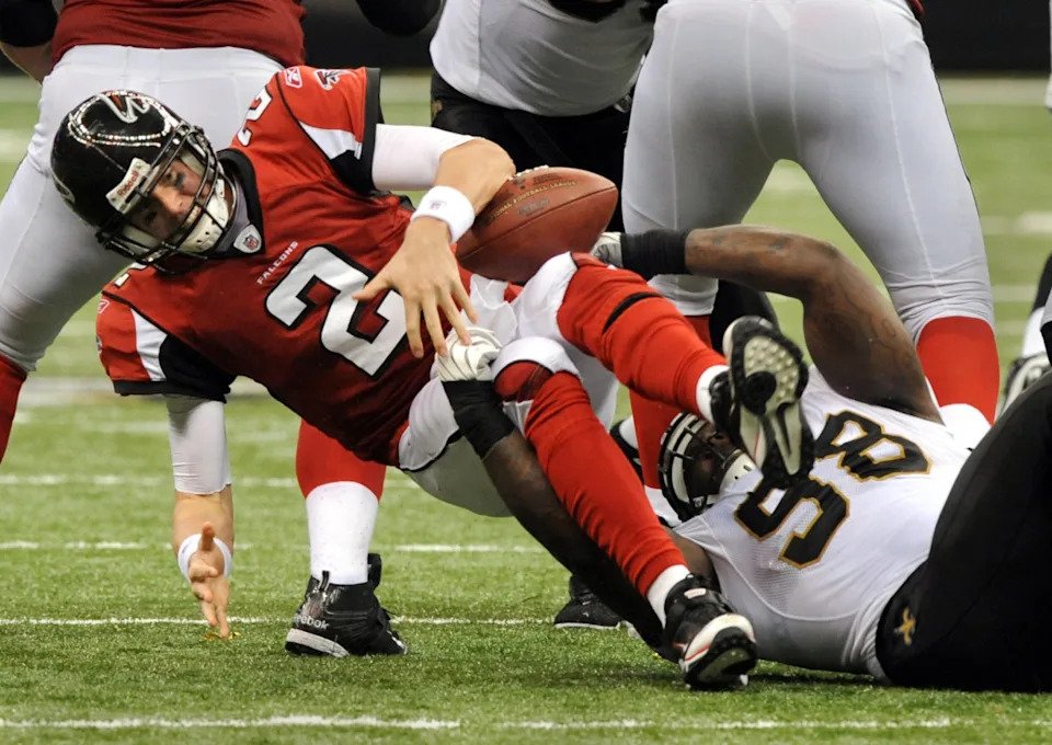 September 26, 2010; Atlanta Falcons quarterback Matt Ryan (2) is sacked by New Orleans Saints defensive tackle Sedrick Ellis (98). Mandatory Credit: Chuck Cook - Imagn Images
