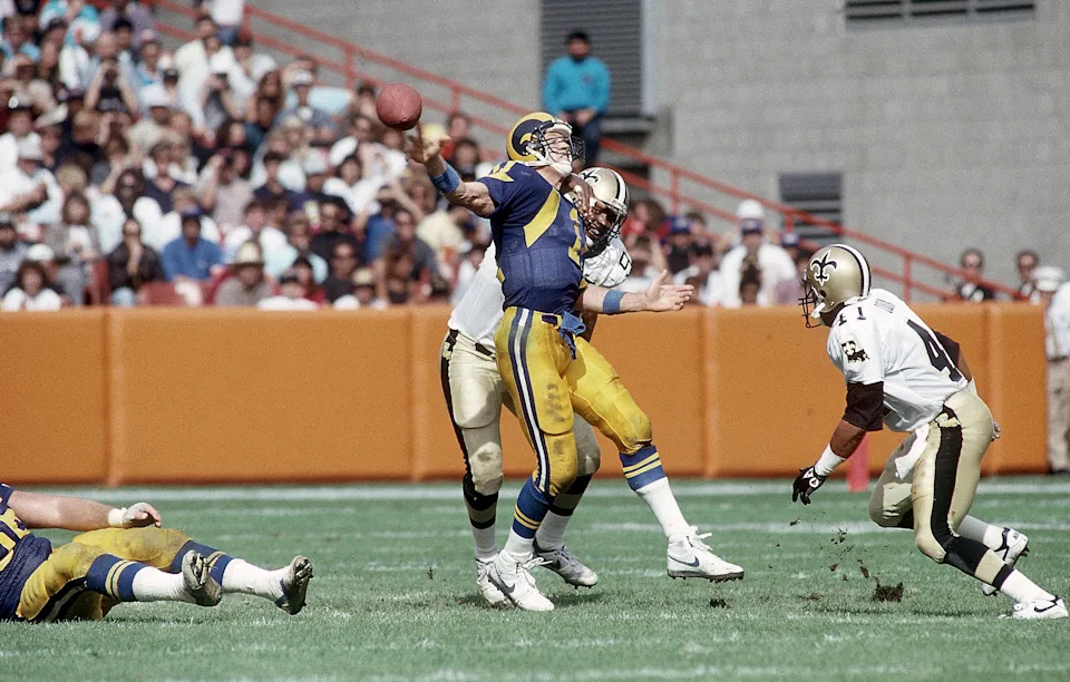 Oct 22, 1989; Anaheim, CA, USA; FILE PHOTO; Los Angeles Rams quarterback Jim Everett (11) in action against New Orleans Saints defenders Jim Wilks (94) and Toi Cook (41) at Anaheim Stadium. Mandatory Credit: Peter Brouillet-USA TODAY NETWORK