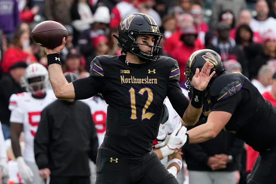 Northwestern Wildcats quarterback Jack Lausch (12) throws during the second half of the NCAA football game against the Ohio State Buckeyes at Wrigley Field in Chicago on Saturday, Nov. 16, 2024. Ohio State won 31-7.