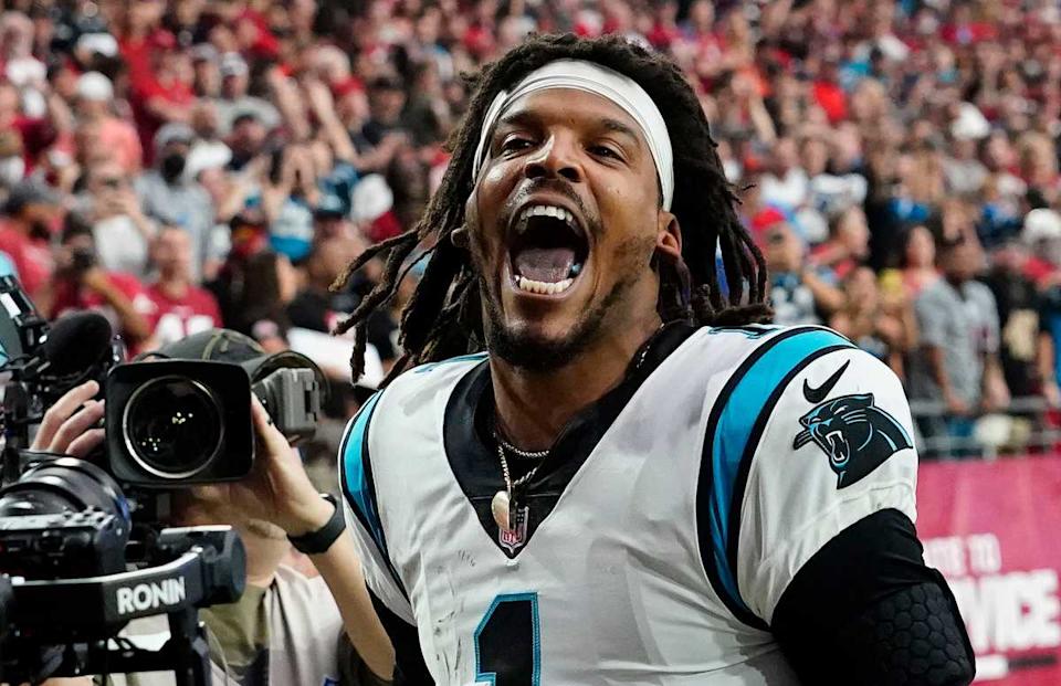 Former Carolina Panthers quarterback Cam Newton yells "I'm back!" after scoring a touchdown.Rob Schumacher / USA TODAY NETWORK