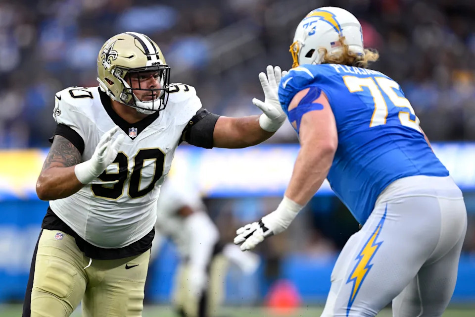 Aug 20, 2023; Inglewood, California, USA; Los Angeles Chargers guard Austen Pleasants (75) blocks New Orleans Saints defensive tackle Bryan Bresee (90) during the first half at SoFi Stadium. Mandatory Credit: Orlando Ramirez-USA TODAY Sports