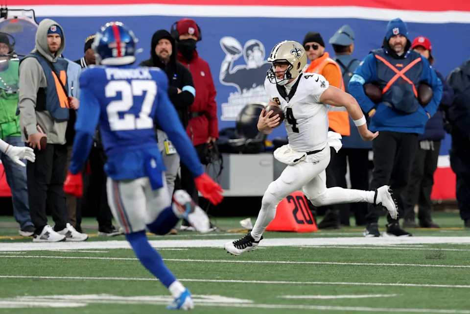 New Orleans Saints quarterback Derek Carr (4) runs with the ball against the New York Giants. Mandatory Credit: Brad Penner-Imagn Images