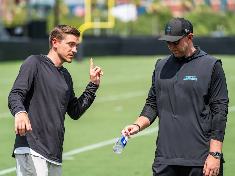 Jacksonville Jaguars general manager James Gladstone, left, talks with Jacksonville Jaguars head coach Liam Coen, right, after the. Jacksonville Jaguars’ mandatory minicamp Tuesday June 10, 2025 at the Miller Electric Center in Jacksonville, Fla. [Doug Engle/Florida Times-Union]
