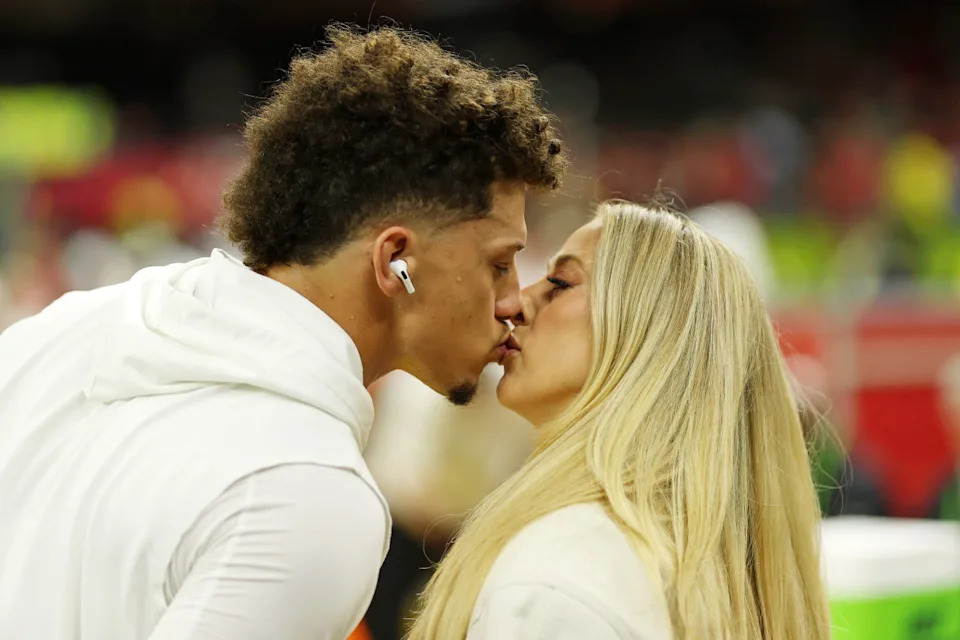 Kansas City Chiefs quarterback Patrick Mahomes kisses his wife Brittany Mahomes before Super Bowl LIX.Geoff Burke-Imagn Images