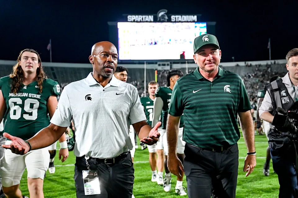 Michigan State football coach Jonathan Smith, right, talks with athletic director Alan Haller after MSU's victory over Florida Atlantic on Friday, Aug. 30, 2024, at Spartan Stadium in East Lansing. Nick King/Lansing State Journal / USA TODAY NETWORKNick King&sol;Lansing State Journal &sol; USA TODAY NETWORK