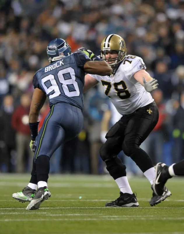 Jan 8, 2010; New Orleans Saints tackle Jon Stinchcomb (78) blocks Seattle Seahawks defensive end Raheem Brock (98) in the NFC Wild Card game. Mandatory Credit: Kirby Lee/Image of Sport-Imagn Images
