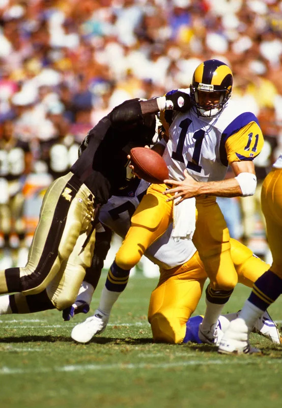Oct 3, 1993; New Orleans Saints linebacker Renaldo Turnbull (97) sacks Los Angeles Rams quarterback Jim Everett (11). Mandatory Credit: Peter Brouillet-USA TODAY NETWORK