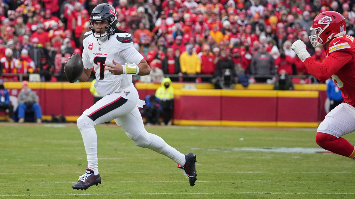 Houston Texans quarterback C.J. Stroud (7) rolls out to throw against the Kansas City Chiefs during the first quarter of a 2025 AFC divisional round game at GEHA Field at Arrowhead Stadium.