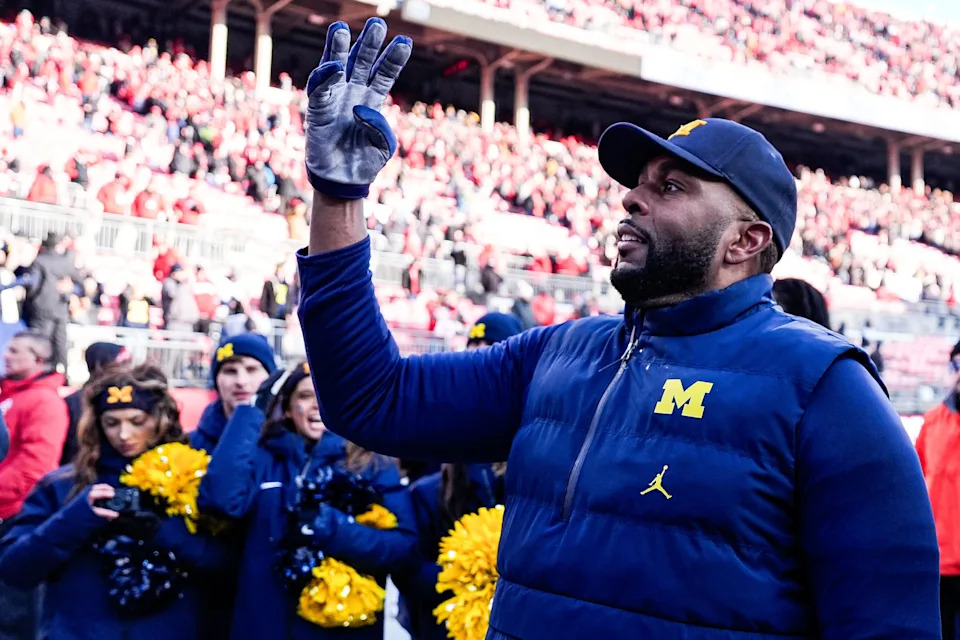 Michigan head coach Sherrone Moore uses a hand signal to celebrate the Wolverines' fourth straight win over Ohio State at Ohio Stadium in Columbus, Ohio on Saturday, Nov. 30, 2024.