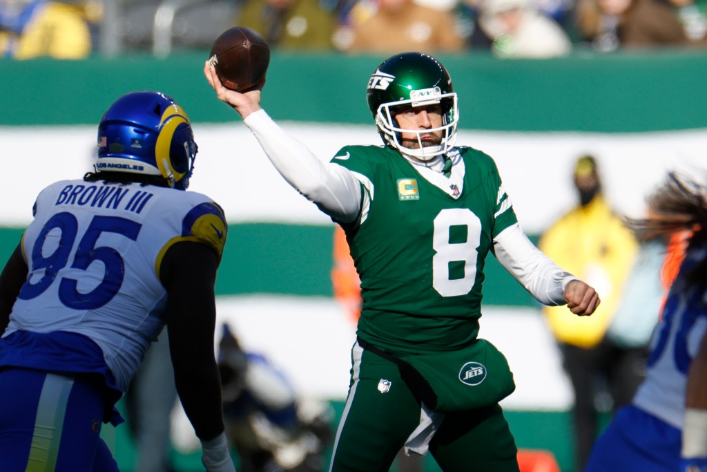Aaron Rodgers, #8 of the New York Jets, throws a football.