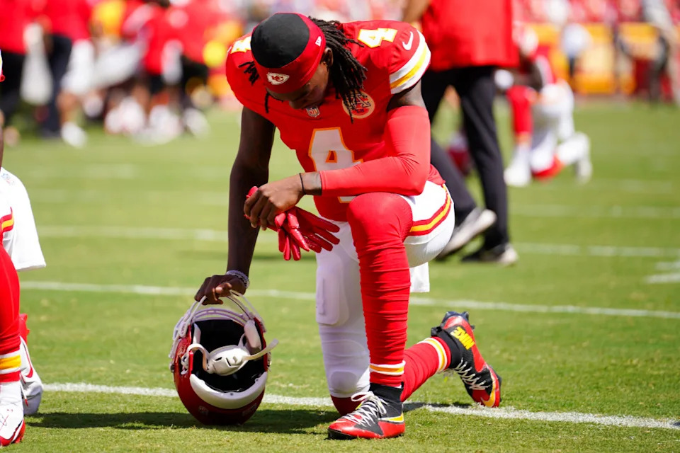 Kansas City Chiefs wide receiver Rashee Rice (4) kneels on field.Denny Medley-Imagn Images