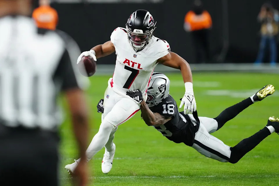Atlanta Falcons running back Bijan Robinson (7) is tackled during a game against the Las Vegas Raiders.Stephen R&period; Sylvanie-Imagn Images