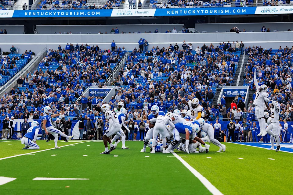 Nov 16, 2024; Lexington, Kentucky, USA; Kentucky Wildcats place kicker Alex Raynor (16) kicks an extra point during the first quarter against the Murray State Racers at Kroger Field. Mandatory Credit: Jordan Prather-Imagn Images