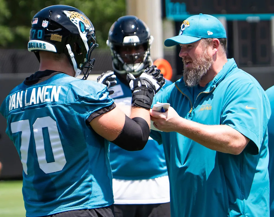 Jacksonville Jaguars Offensive Line Coach Shaun Sarrett coaches Jacksonville Jaguars offensive tackle Cole Van Lanen (70) during the fourth organized team activity at the Miller Electric Center in Jacksonville, Fla. Tuesday, May 27, 2025. [Doug Engle/Florida Times-Union]