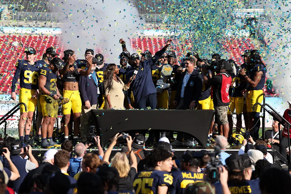 Dec 31, 2024; Tampa, FL, USA; Michigan Wolverines head coach Sherrone Moore celebrates after beating the Alabama Crimson Tide in the ReliaQuest Bowl at Raymond James Stadium. Mandatory Credit: Nathan Ray Seebeck-Imagn Images