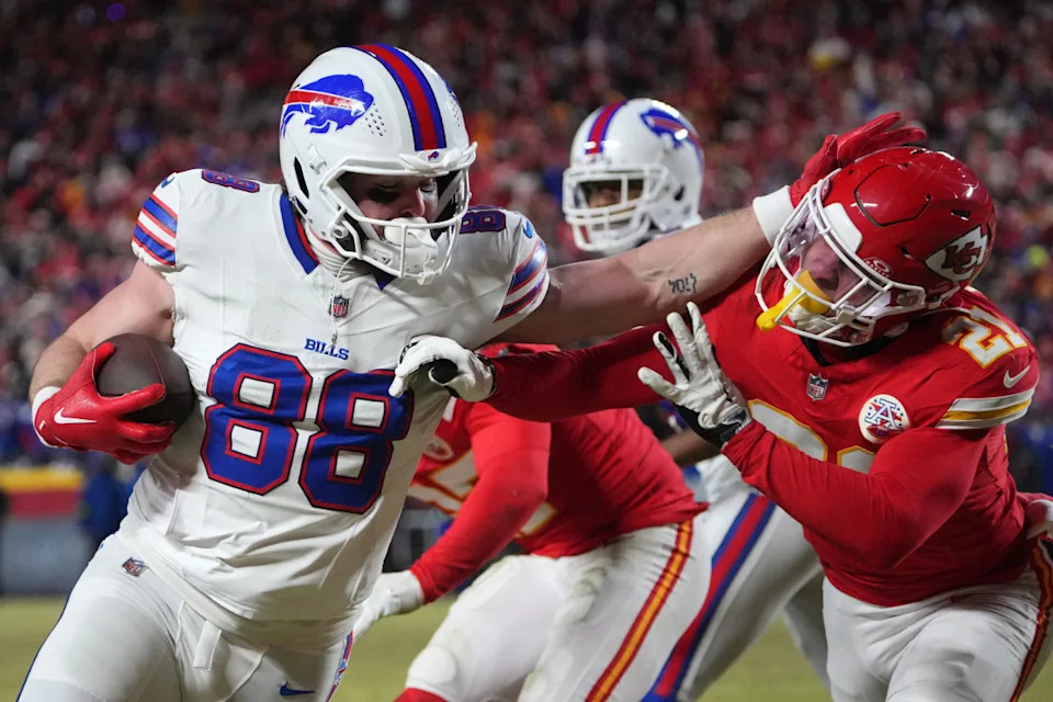 Jan 26, 2025; Kansas City, MO, USA; Buffalo Bills tight end Dawson Knox (88) makes a catch against Kansas City Chiefs safety Jaden Hicks (21) during the second half in the AFC Championship game at GEHA Field at Arrowhead Stadium. Mandatory Credit: Denny Medley-Imagn Images Denny Medley-Imagn Images