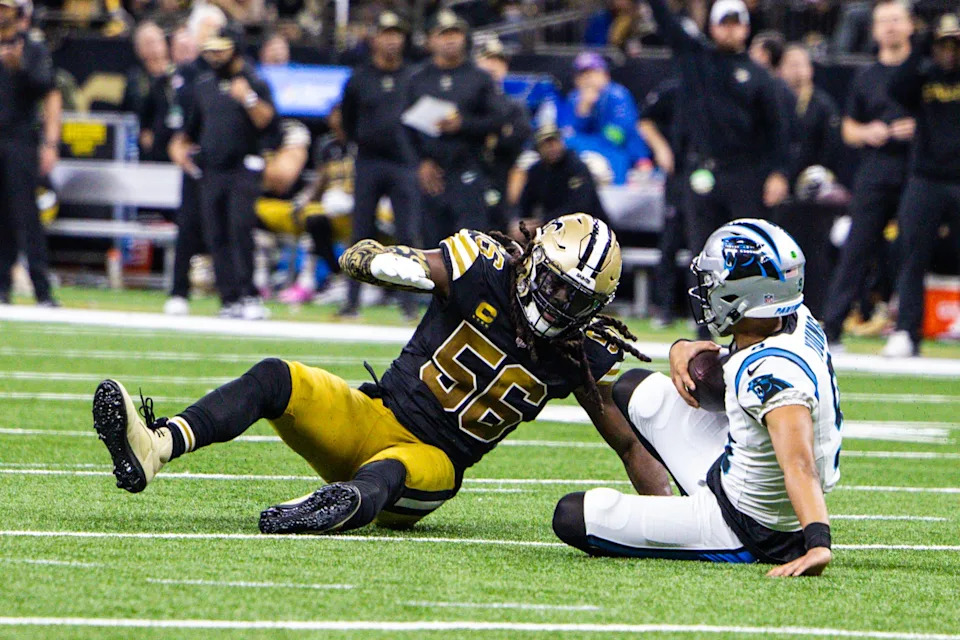 Dec 10, 2023; New Orleans, Louisiana, USA; Carolina Panthers quarterback Bryce Young (9) is sacked by New Orleans Saints linebacker Demario Davis (56) during the second half at the Caesars Superdome. Mandatory Credit: Stephen Lew-USA TODAY Sports