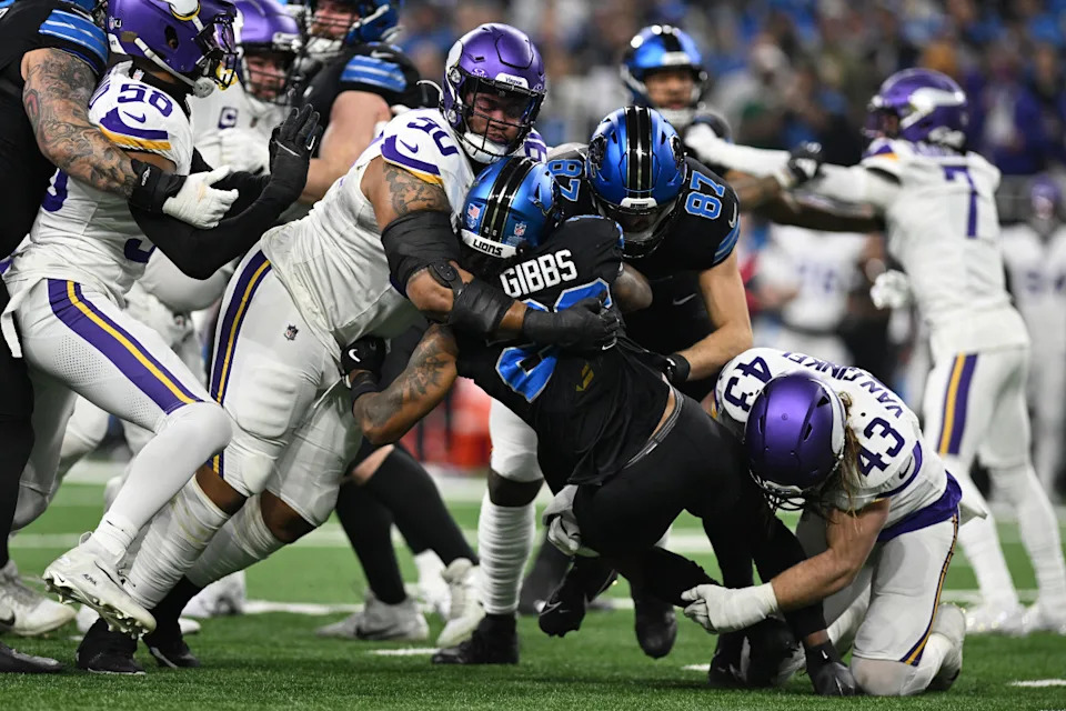 Detroit Lions running back Jahmyr Gibbs (26) gets tackled by Minnesota Vikings defensive end Jonathan Bullard (90). Mandatory Credit: Lon Horwedel-Imagn Images