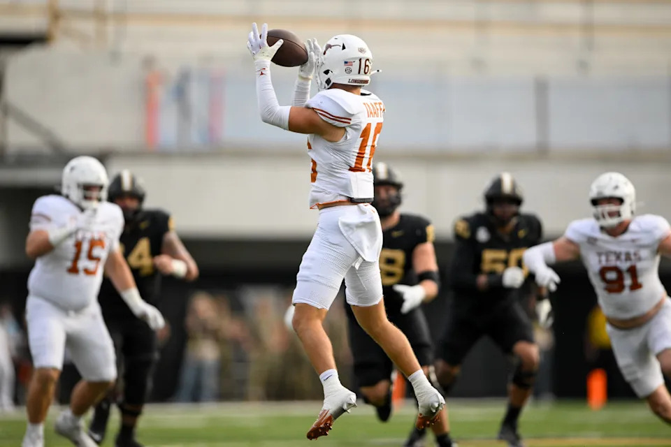 Oct 26, 2024; Nashville, Tennessee, USA; Texas Longhorns defensive back Michael Taaffe (16) intercepts a pass against Vanderbilt Commodores quarterback Diego Pavia (2) during the first half at FirstBank Stadium.Steve Roberts-Imagn Images