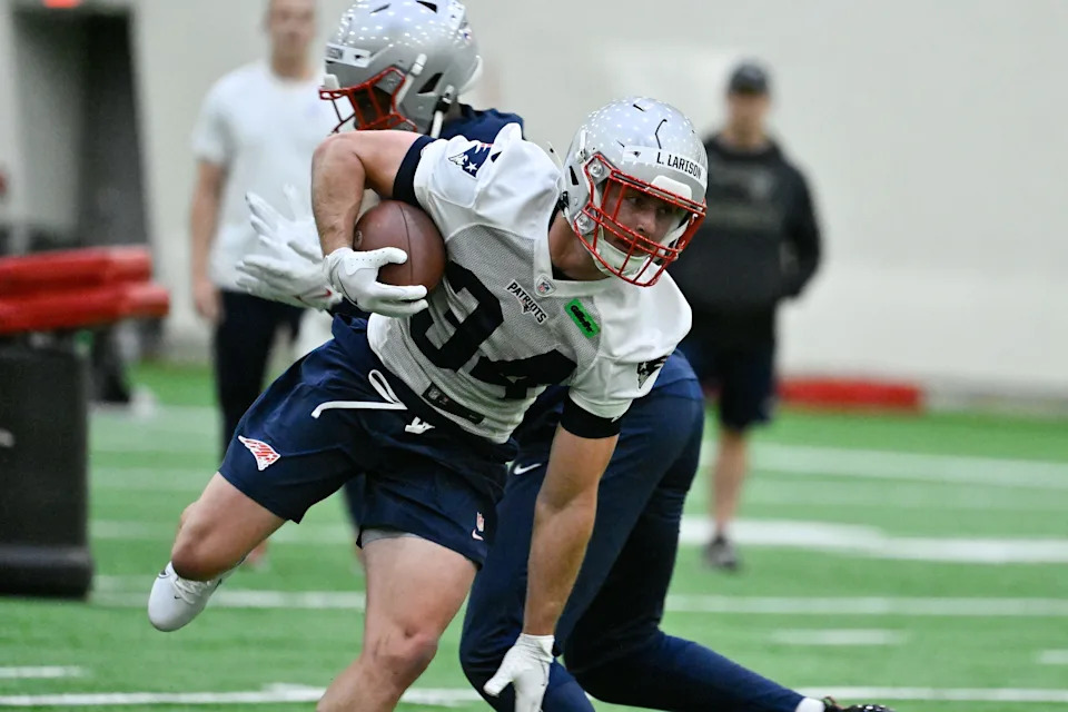 May 9, 2025; Foxborough, MA, USA; New England Patriots running back Lans Larison (34) breaks a tackle during rookie camp at Gillette Stadium. Mandatory Credit: Eric Canha-Imagn Images