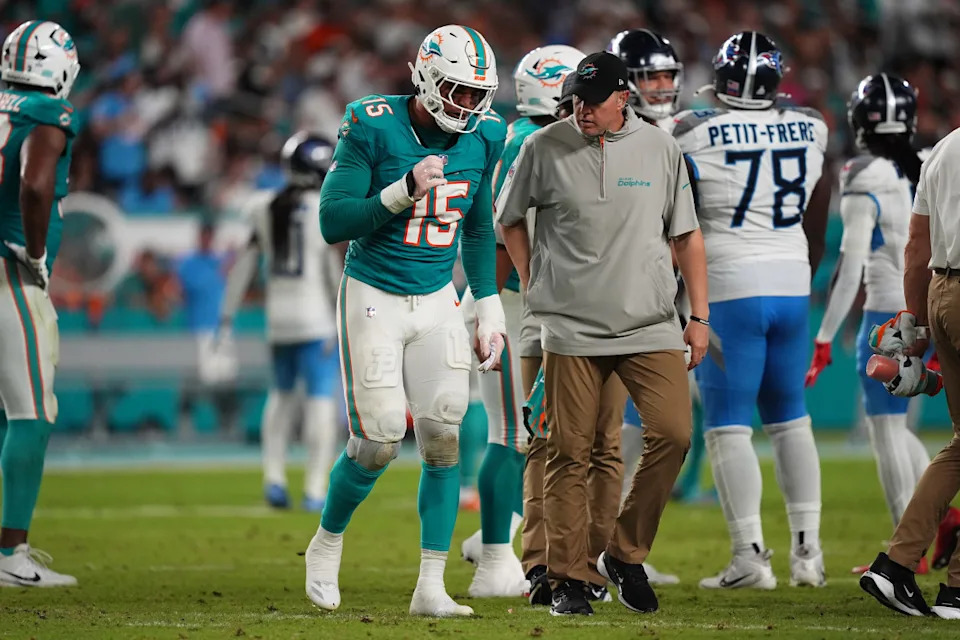 Miami Dolphins linebacker Jaelan Phillips (15) walks off the field with a team trainer after an apparent injury during the second half against the Tennessee Titans at Hard Rock Stadium.Jasen Vinlove-Imagn Images